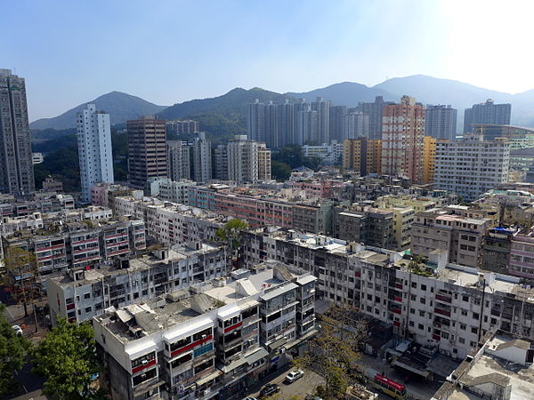 Tai Po Market. Older low-level buildings in the foreground contrast with high-rise commercial buildings in the distance