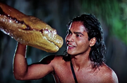 Face-à-face entre le python Kaa et le petit d'homme Mowgli