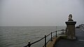 English: The Solent and one of the Cowes Lion sculptures, Cowes, Isle of Wight, in terrible weather in February 2011. The mist was thick enough to prevent seeing the mainland, for at least three days. This photograph was taken on Egypt Esplanade at the foot of Egypt Hill, looking west along with Queen's Road on the very right of the photograph.