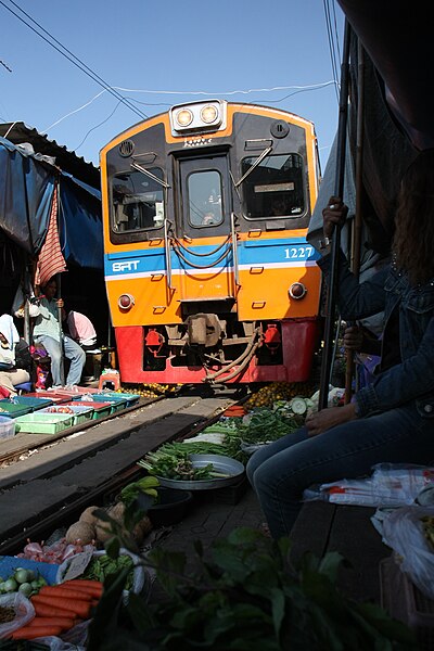 File:Train at Samut Songkhram market on the rails.jpg