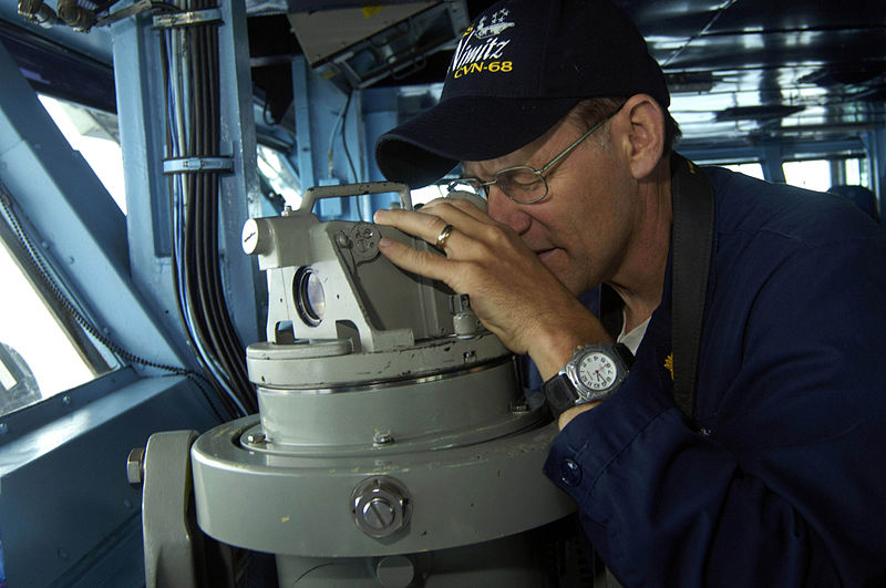 File:US Navy 090803-N-3038W-106 Chief Warrant Officer 2 James Frost uses a telescopic alidade to find surface and air contacts.jpg