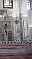 The white pulpit marks the place where ‘Alī ibn Husayn addressed the court of Yazīd and the raised floor in front of it marks where the prisoners of Karbalā stood during that time.