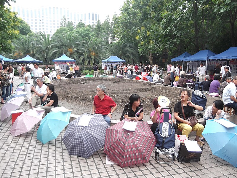 File:Umbrellas at marriage market, Shanghai.JPG