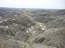 The Valley of 1000 Devils in the East Block Valley of 1000 Devils Grasslands NP.jpg