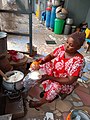 A Dagomba woman wrapping rice balls in Northern Ghana 02