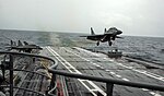 A MiG-29K performs a touch and go landing on INS Vikramaditya during Narendra Modi's visit.jpg