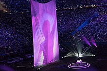 Justin Timberlake performs on piano alongside projected archive footage of Prince during the Super Bowl LII halftime show A Prince projection shows up at the Super Bowl LII Half Time Show, Minneapolis MN (39407983344).jpg