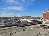 Two Amtrak trains at Albany–Rensselaer station, as viewed from the parking deck over the platforms