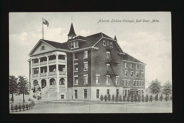 Exterior view of Alberta Ladies College, Red Deer, Alberta, and adjacent grounds. 1912. University of Alberta Libraries Historical Postcard Collection. Alberta Ladies College grounds.jpg