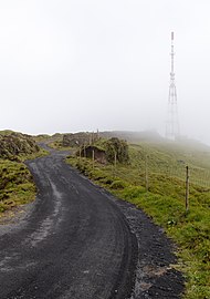 Antenna tower in a foggy day near Barrosa Viewpoint, São Miguel Island, Azores, Portugal