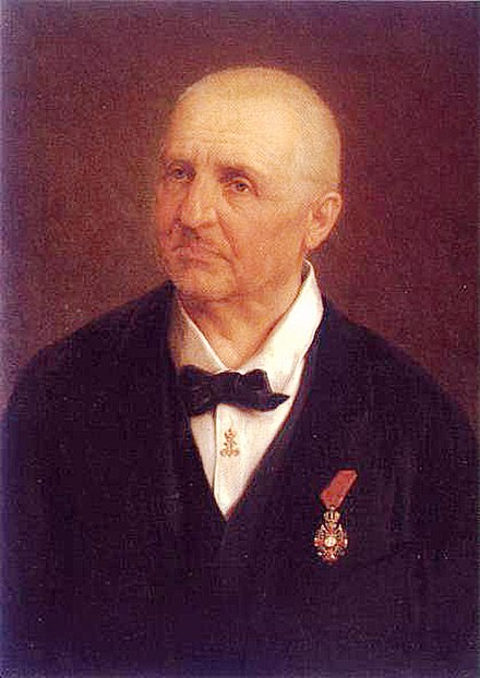 Anton Bruckner wearing the badge of the Order of Franz Joseph (portrait by Josef Büche [de])