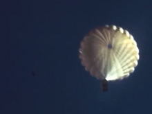 Beaver drop box parachuting to land Idaho 1950 Beaver drop box parachuting to land Idaho 1950.png