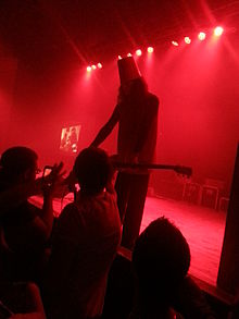 Buckethead letting fans use the kill switch on his guitar during his show at the Granada in Lawrence, Kansas on April 15, 2016 Buckethead killswitch.jpg