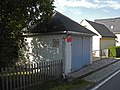 Syringe house and plaque