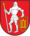 A coat of arms depicting a man in full body armour holding a white spear in his right hand and a red-and-yellow shield in his left hand