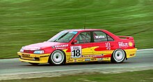 Watts driving for Peugeot at Brands Hatch during the 1994 British Touring Car Championship season. DSC00047 (45827561045).jpg