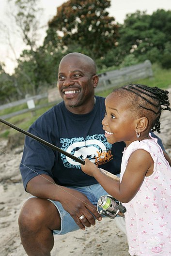 Dad and daughter fishing young girl learns to fish.jpg