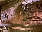 Defaced Meditating Yogi in Cave, with both Buddha and Vishnu features 2, Badami monuments Karnataka.jpg
