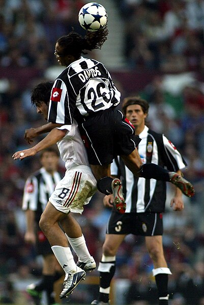 Juventus' Davids clashing with AC Milan's Gennaro Gattuso during the final of the UEFA Champions League on 28 May 2003
