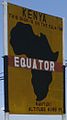 English: A sign to materialize the equator in Kenya. Français : Un panneau pour matérialiser l'équateur au Kenya.