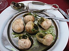 Escargot at a restaurant. May 24 is National Escargot Day. Escargotbordeaux.jpg