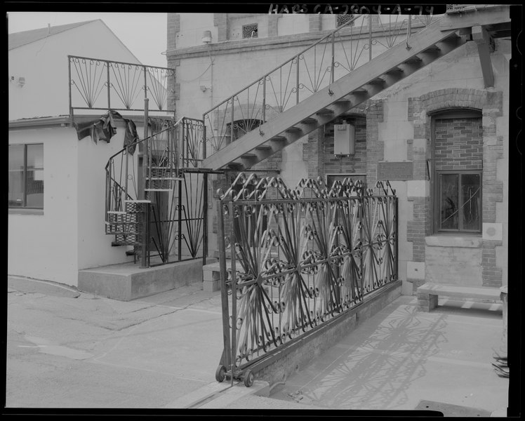 File:Exterior building details of Building C, east faand-231;ade- rolling metal gate and fence, spiral and inclined staircases; southwesterly view - San Quentin State Prison, Building 22, HABS CA-2804-A-74.tif