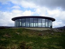 The gun emplacement has today a protective cover, which houses a cafe. The area around the emplacement has been changed a lot from what it looked like originally. Today, it is not representative for what it looked like during the years when the gun was mounted. Fjell festning.jpg