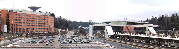 Flemingsberg railway station (in white), the police station (in red brick) and the jail, part of the district court house on the left. To the right of the railway station is Sodertorn University. Flemingsberg jarnvagstation.jpg