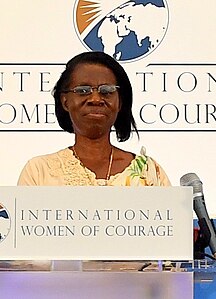 Godelieve Mukasarasi speaks at IWOC 2018.jpg