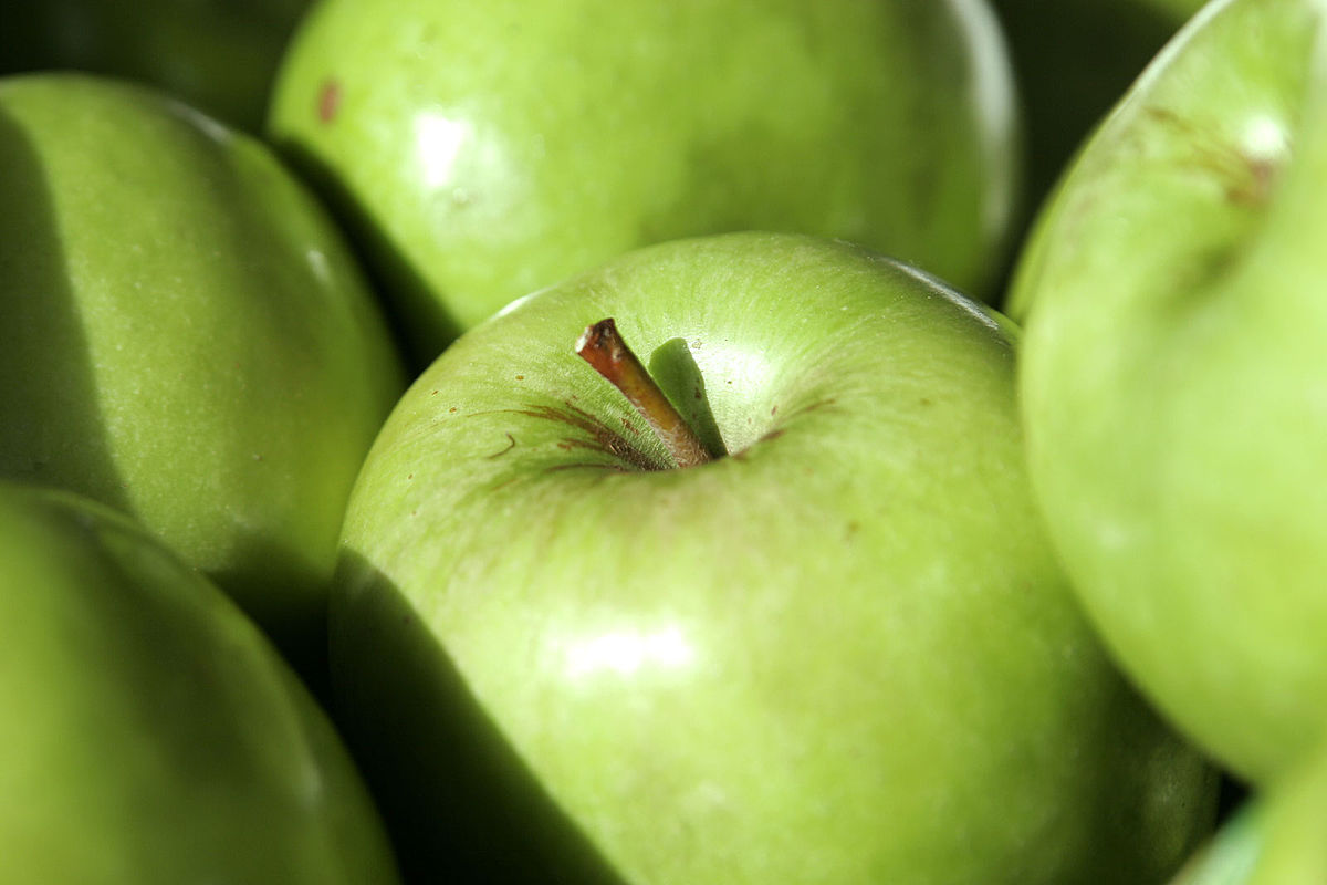 Green juicy organic Granny Smith Apples. Raw fruit background. Front view.  Close up. Stock Photo by poetique_id