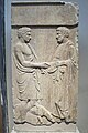 Grave stele depicting two men handshaking and a dog, 4th cent. B.C. National Archaeological Museum, Athens.