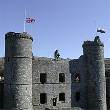 Harlech Castle with flags at half mast after death of Queen Elizabeth the Queen Mother 2002 (C)