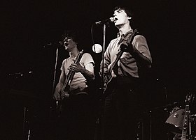 Harrison and Byrne (right) with Talking Heads in August 1978 at Jay's Longhorn Bar, Minneapolis, Minnesota Harrison and Byrne-Talking Heads.jpg