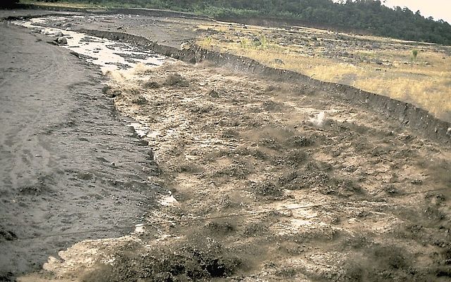 A lahar travels down a river valley in Guatemala near the Santa Maria volcano, 1989