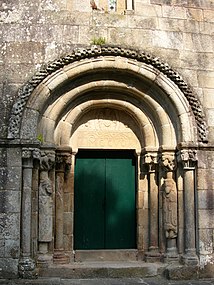 Portal of the church of São Pedro de Rubiães with two human figures on the door collonettes and Christ in Majesty on the tympanum.