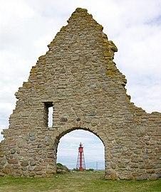Lighthouse at Kapelludden through the chapel ruins