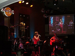 Nina performing "Someday" on her gig at Hard Rock Cafe in 2010. Nina - Someday @ HRC.jpg