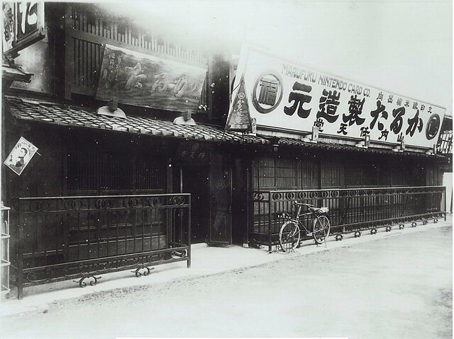 Original Nintendo headquarters (1889–1930) and workshop in Shimogyō-ku, Kyoto, c. 1889. The right section was eventually rebuilt (pictured below), and