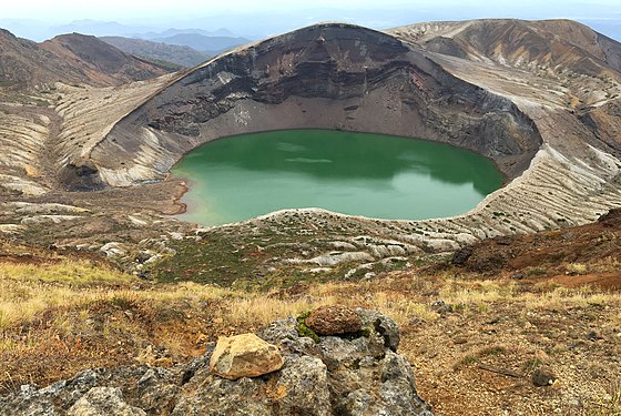 Okama crater lake on Mt. Zao in the Tohoku region of Japan has a circumference of 1,000 m and a depth of 27 m. The acidic water-filled crater is called "Okama" because it resembles a traditional Japanese cooking pot of the same name.