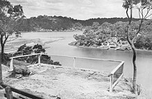 View of the mouth of Lime Kiln Bay, from Hills Lookout toward Illawong and Lugarno, showing former oyster farming racks on left (date unknown). Oyster Farms at Oatley (2734724590).jpg