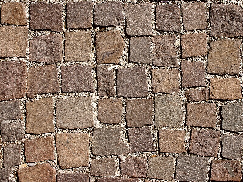 File:Pavement made of cobblestone of quartz porphyr.jpg