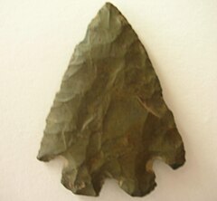 A knapped flint arrowhead.