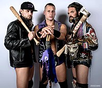 Record three-time and inaugural champions, The Kingdom (left to right: T. K. O'Ryan Matt Taven, and Vinny Marseglia). ROH Kingdom.jpg