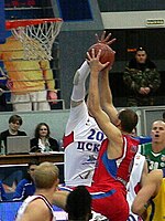 Ramunas Siskauskas in red, with the ball, during the 2011 Russian PBL All-Star Game. Ramunas Siskauskas vs Andrey Vorontsevich at all-star PBL game 2011.JPG