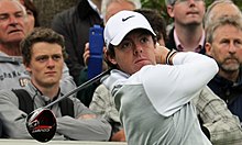 McIlroy during a practice day for the BMW PGA Championship in 2013 at Wentworth Rory McIlroy watches drive flight (crowd, landscape orientation).jpg