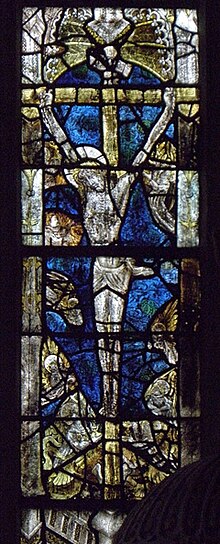 Photo of a stained-glass lancet depicting Jesus Christ on the cross