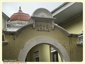 Sign indicates 1913 in back of Residencia Cardona in Aguadilla, Puerto Rico.jpg