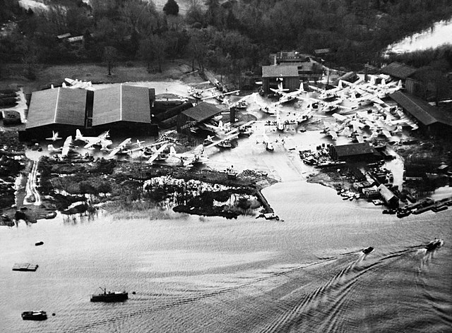 Various flying boats are being hauled out of Lough Erne as the water begins to freeze in January 1945