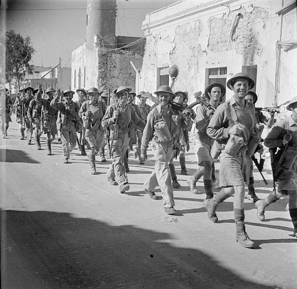 Infantrymen of the 1/6th Battalion, Queen's Royal Regiment (West Surrey) marching into Tobruk, Libya, 18 November 1942.