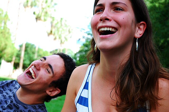 two people laughing together